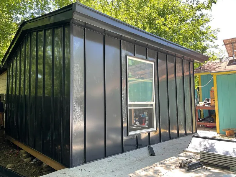 Black standing seam metal wall panels for Metal Roof Installation in Stewartville