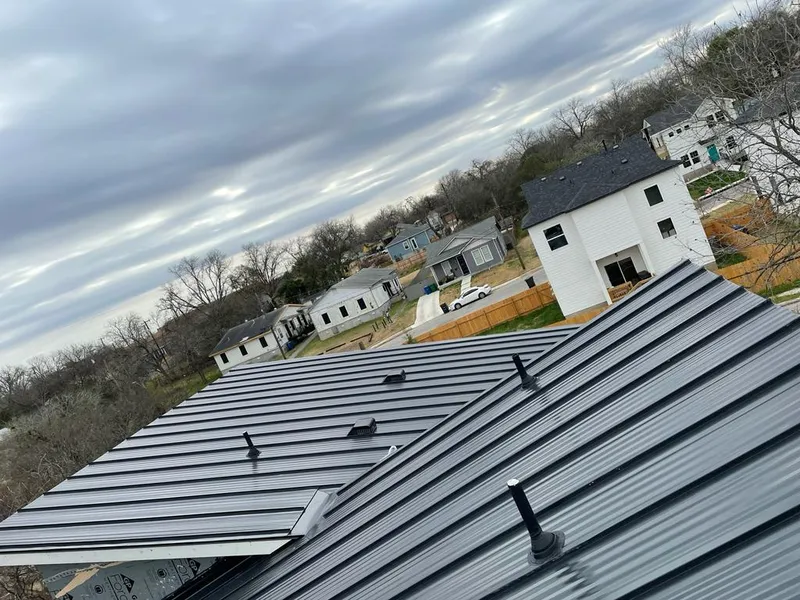 Standing seam metal roof panels with vents for Skylight Repair in Stewartville